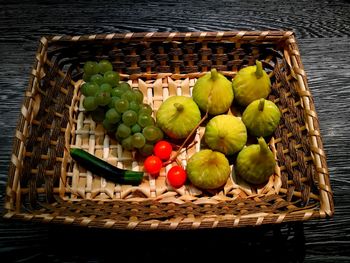 High angle view of grapes in basket