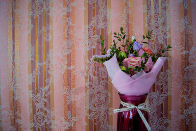 Close-up of potted plants against wall