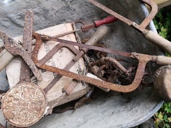 High angle view of rusty metal on wood