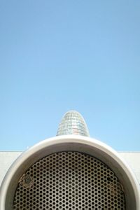 Low angle view of building against clear blue sky