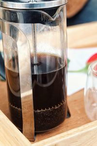 Close-up of coffee in glass on table