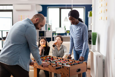 Rear view of business colleagues working at office