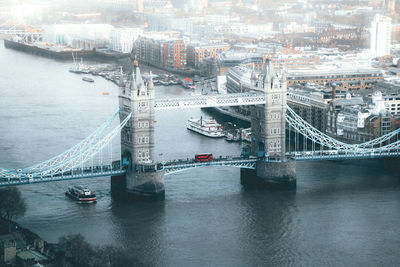 Bridge over river with building in background