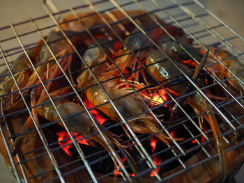 High angle view of prawns on barbecue grill