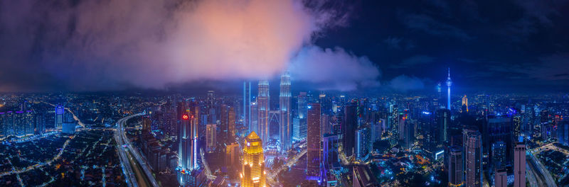 Panoramic view of illuminated against sky at night in kuala lumpur