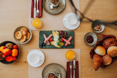 Directly above shot of breakfast brunch food on table