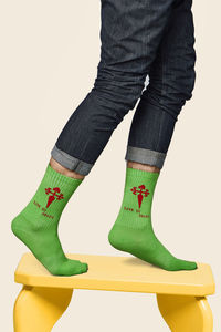 Low section of man standing against white background