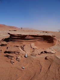 Scenic view of desert against clear sky