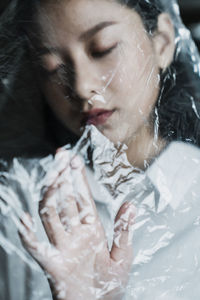 Close-up of young woman smoking