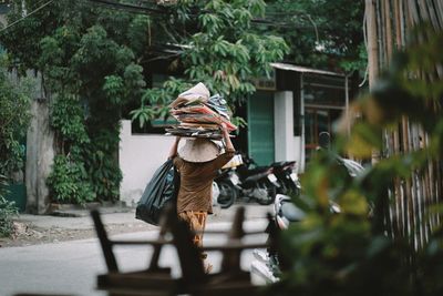 Rear view of a man walking on road