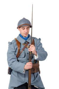 Young man standing against white background