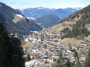 High angle view of townscape and mountains against sky