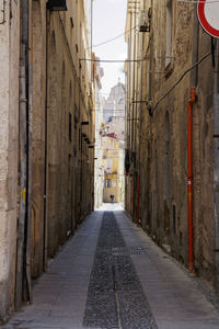 Narrow alley along buildings