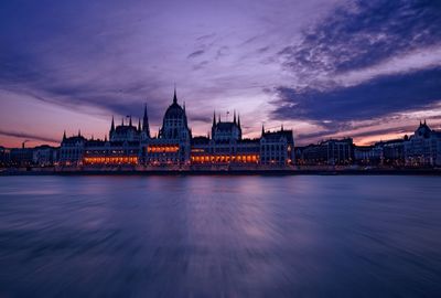 View of city lit up at dusk