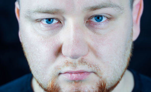 Close-up portrait of man with blue eyes