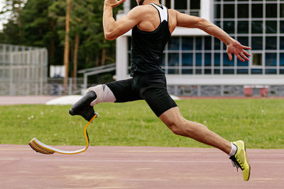 Side view of woman exercising in gym