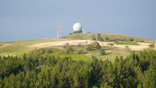 Built structure on landscape against clear sky