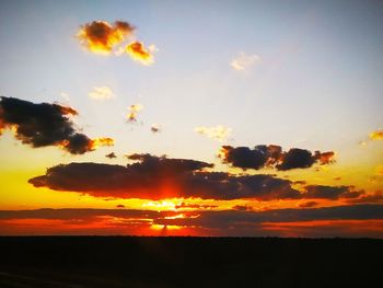 Scenic view of silhouette landscape against romantic sky at sunset