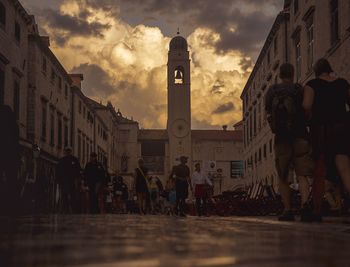 People in city against sky