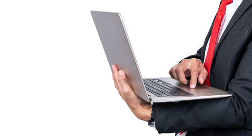 Man using mobile phone against white background