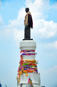 Low angle view of statue against sky