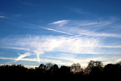 Low angle view of vapor trails in sky