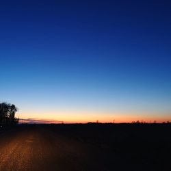 Scenic view of silhouette landscape against clear sky during sunset