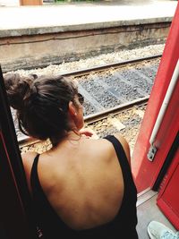 Rear view of woman sitting in car