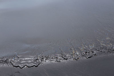 High angle view of wet street during winter