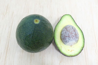 Close-up of green fruits on table