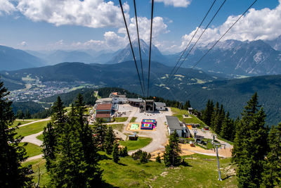 High angle view of overhead cable car and trees against sky