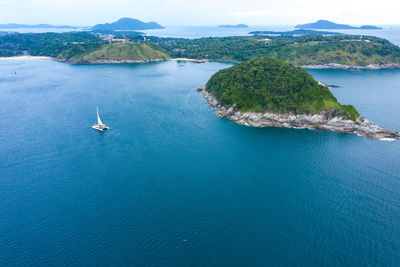 Aerial island view of ko man, thailand. view amazing view to catamaran cruising in open sea at windy