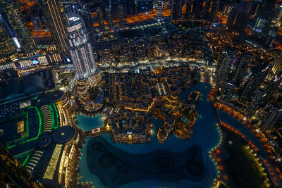 High angle view of illuminated buildings in city at night