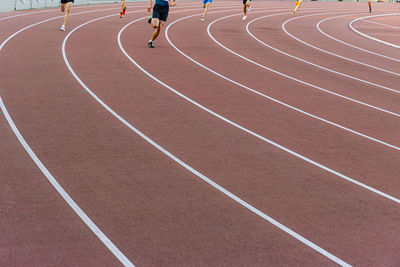 Full length of woman running at roadside