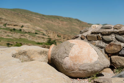 Close-up of rocks against clear sky