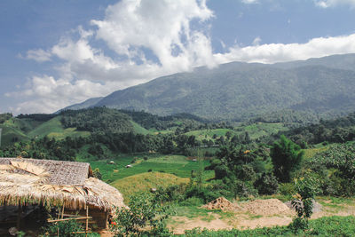 Scenic view of landscape and mountains against sky