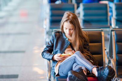 Young woman sitting on chair