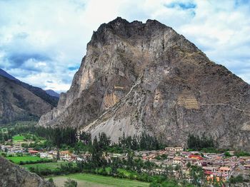 Scenic view of mountain against cloudy sky