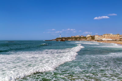 Scenic view of sea against clear blue sky