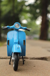 Close-up of blue toy car on land