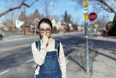 Woman standing on street