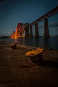 Low angle view of suspension bridge at night