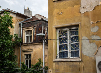 Low angle view of old building against sky