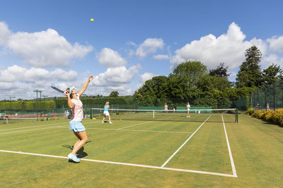 Mature women during a tennis match on grass court