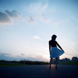 Woman standing on field