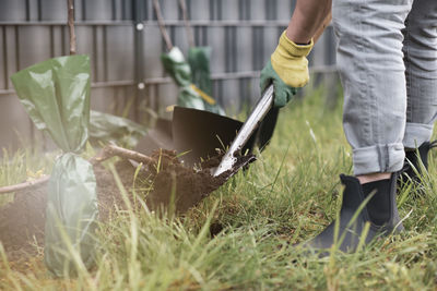 Low section of man working on field