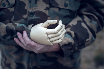 Midsection of man with artificial limb