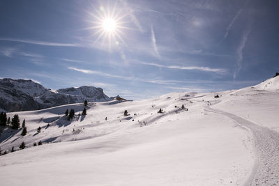 Scenic view of snowcapped mountains against sky