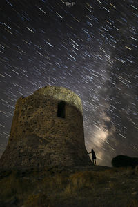 Low angle view of old building against sky at night