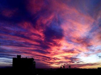 Low angle view of cloudy sky at sunset
